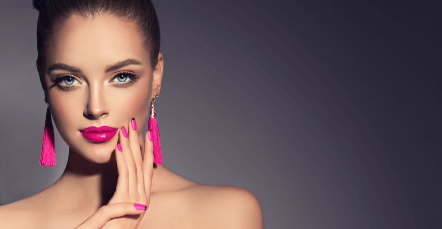 brunette girl with pink earrings